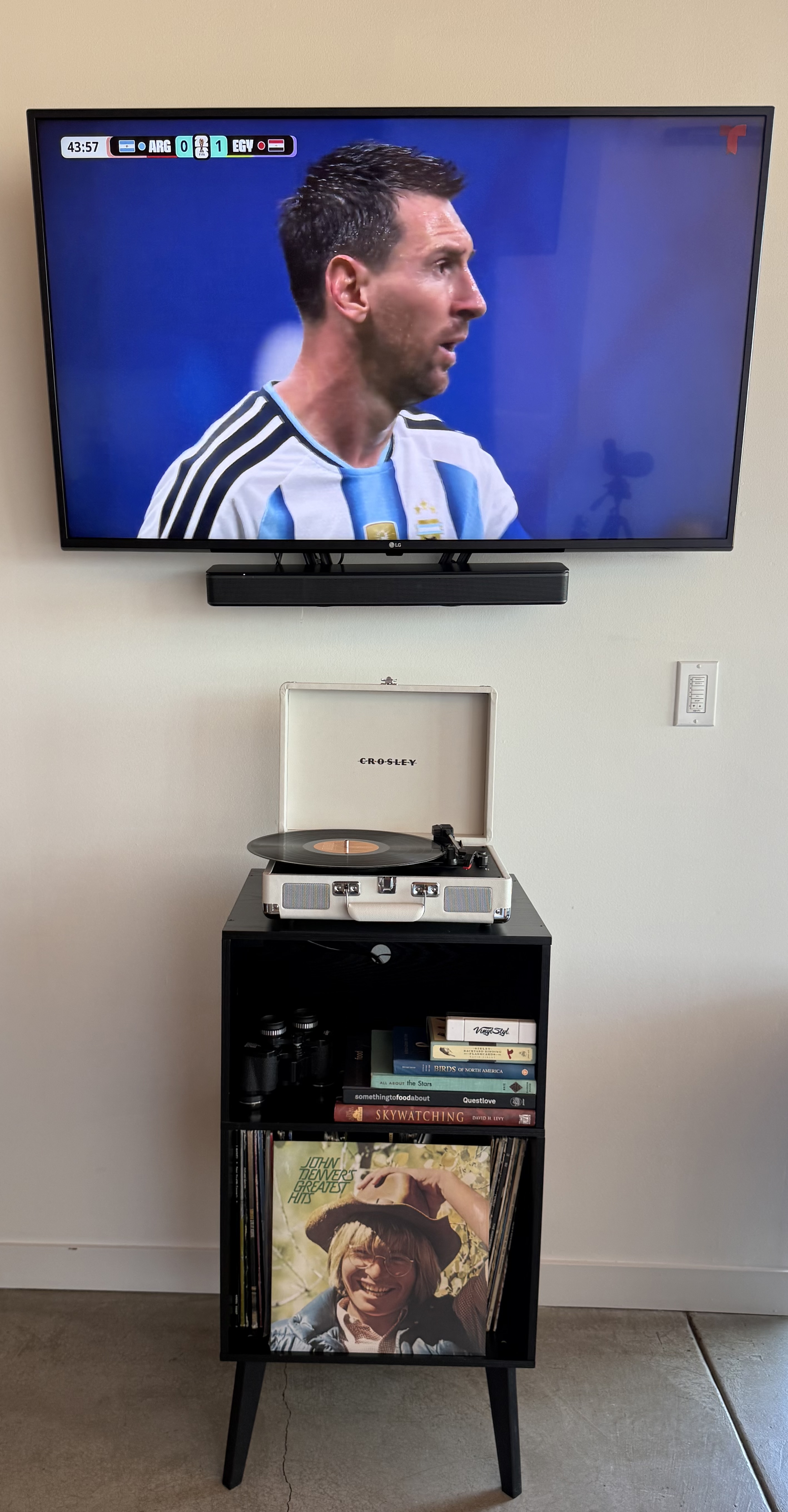 Turntable with vinyl collection and smart TV in the living room